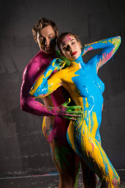 Nude couple paint with with color himself - Fotoğraf, Görsel