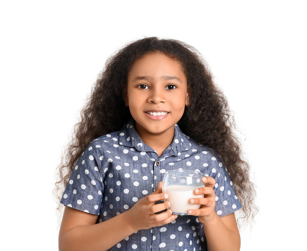 Little African-American girl with milk on white background - Fotó, kép