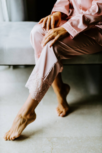 woman wearing nightwear pijama at home. Legs close up - Foto, Imagem