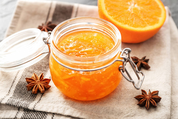 Jar of orange jam on table - Photo, Image