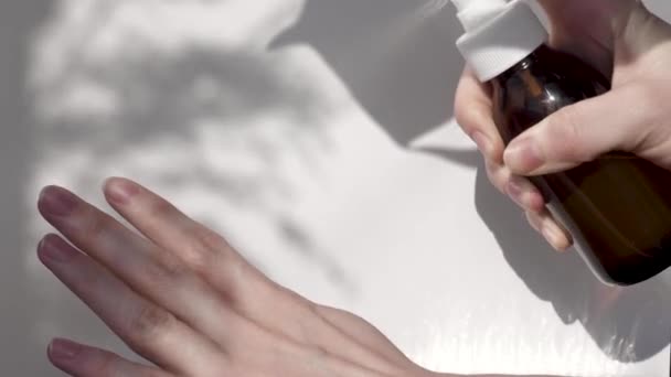 Hand sanitizer on a white background - Záběry, video