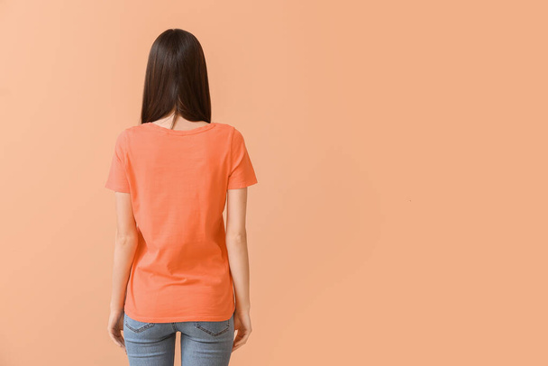 Woman in stylish t-shirt on color background - Photo, Image