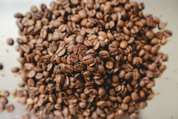 Roasted coffee beans pile. From top view - 写真・画像