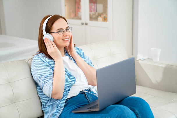 woman listen audio lesson or book on headphones. - Photo, image