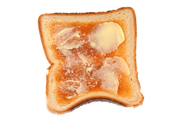 Egy szelet lágy kenyér vajjal közelkép fehér háttér  - Fotó, kép