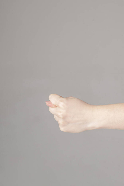 Fico gesture of a hand on a white background - Foto, Imagen