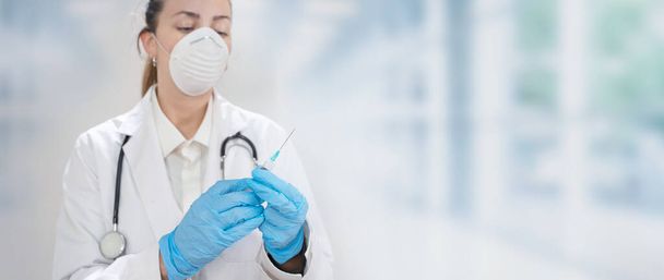 Coronavirus. Doctors and nurses working in the hospitals and fighting the coronavirus. Female doctor in the protective suit and mask looking for a cure for the disease. Copy text. Hospital background. Graphic design banner - Фото, изображение