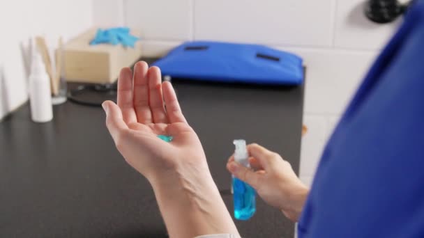 doctor or nurse spraying hand sanitizer - Video, Çekim