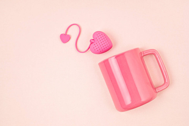 Flat lay with heart shaped tea bag and cup. Waking up, morning tea, every day rituals, zen attitude, destress, healthy drink, love concept - Photo, Image