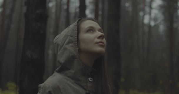 Beautiful Woman Stands In Forest And Feels Happy. Good-looking Girl Looking Up At Sky And Enjoys Her Life. Hipster Teen Girl Traveler Walks Outdoors And Breathes Fresh Air After Hard Day At Work - Footage, Video