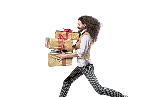 Skinny man running with the bunch of gifts - Fotoğraf, Görsel