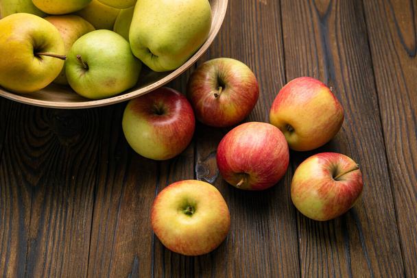 apples on a wooden, brown background - Fotó, kép