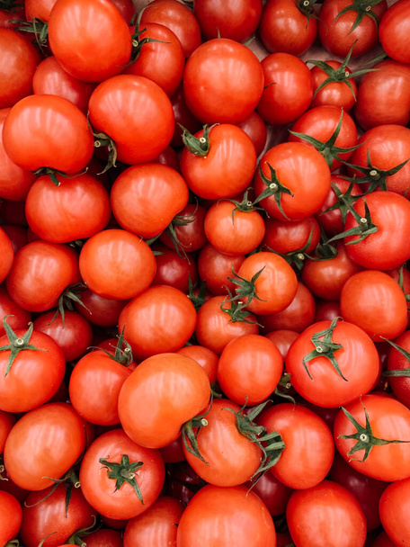 lots of ripe delicious tomato tomatoes for eating background - Photo, Image