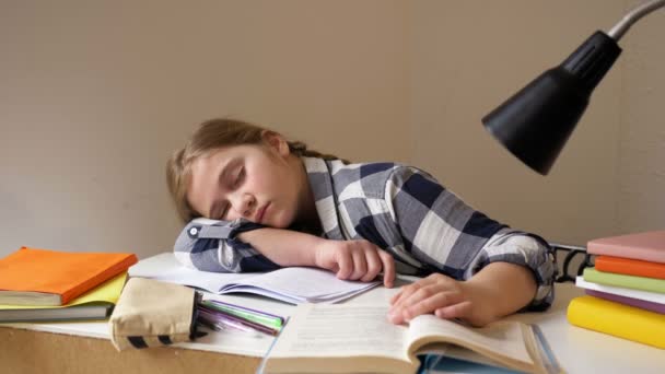 Girl fell asleep doing homework. Distance learning during quarantine - Záběry, video