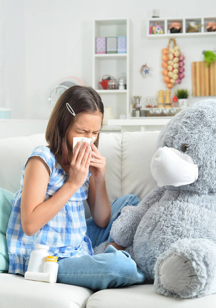 little girl coughing  with toy teddy  bear in facial mask - Photo, image
