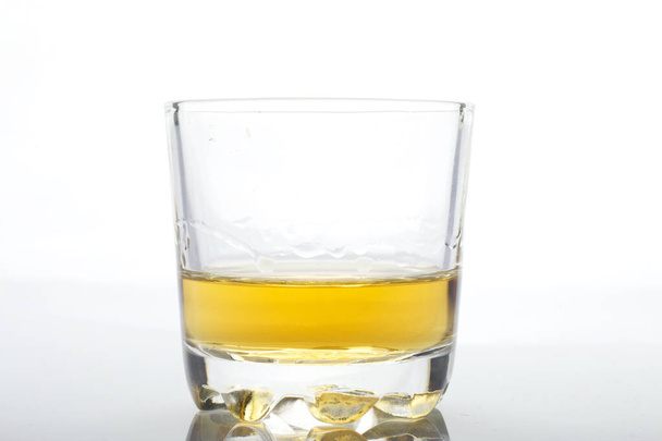 Glass transparent glass with strong alcohol. On a white background. - Foto, imagen