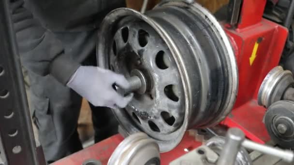 Process of tire repairing. Repair a tire from car by mechanic. Winter tires - Footage, Video