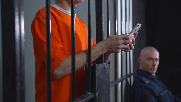 Prisoner allowed to use smartphone. Close up - Photo, Image