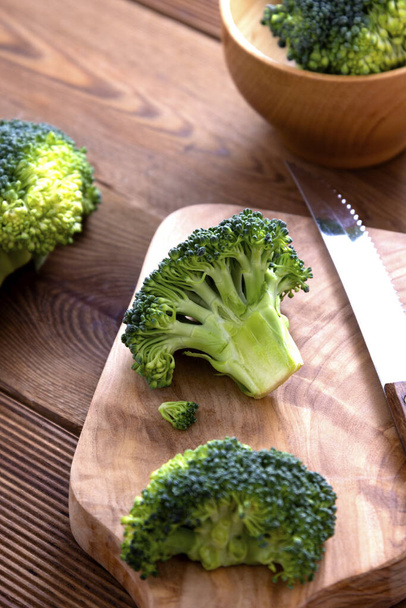 Fresh broccoli on wooden table. Healthy food. - Foto, Bild
