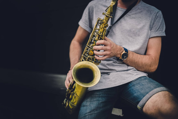 Musician playing alto saxophone on a gig. - Zdjęcie, obraz