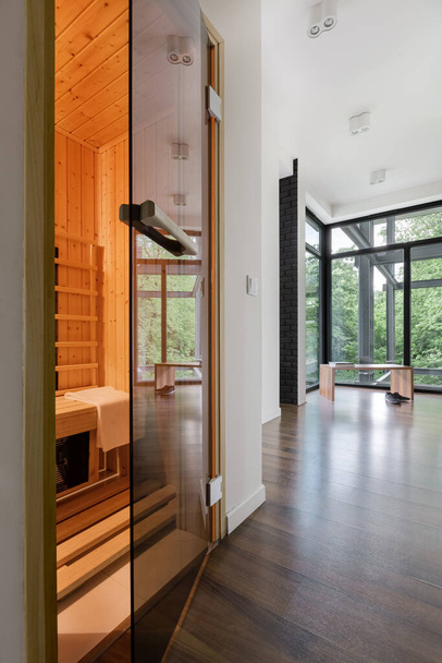 Wide home corridor with big window and sauna room open - Foto, imagen