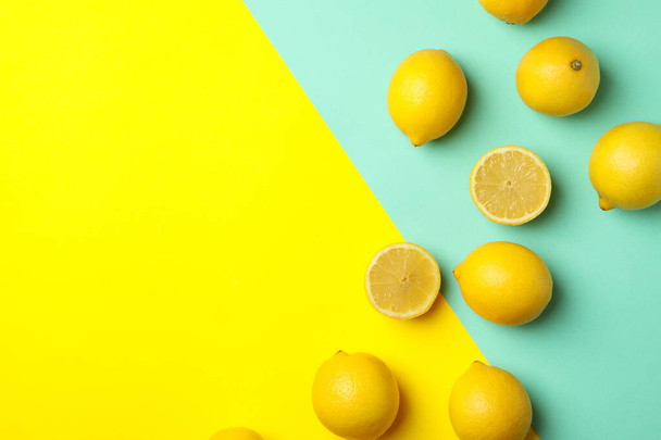 Fresh lemons on two tone background, top view. Ripe fruit - Foto, immagini