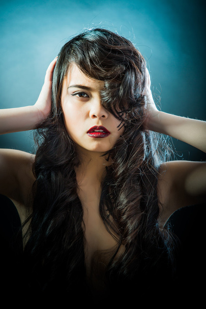Beautiful brunette Asian woman with long black hair - Photo, Image