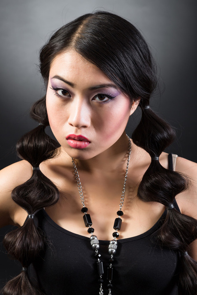 Beautiful brunette Asian woman with long black hair - 写真・画像