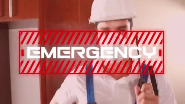 Animation of the word Emergency written in white letters in red frame over a man dressed in protective gloves, helmet and a face mask, holding disinfectant spray in the background. - Záběry, video