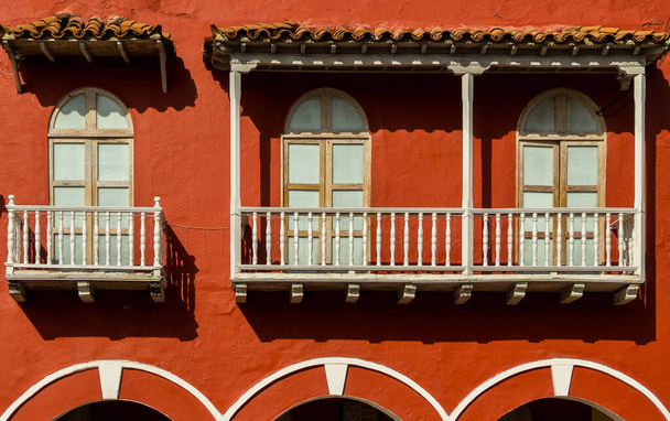 Typical Spanish colonial style windows and balconies with awning in Cartagena old city, Colombia. - Photo, Image
