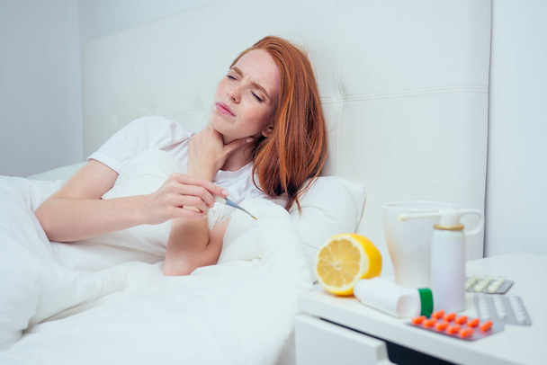 redhaired ginger woman wrapped at blanket and feeling bad mood because she is infection flu - Foto, immagini