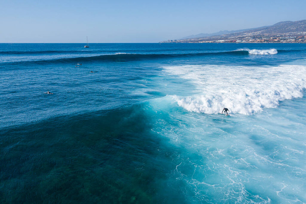 Surfer rides on a wave. Wave of the Atlantic Ocean. Warm tropical water. - Φωτογραφία, εικόνα