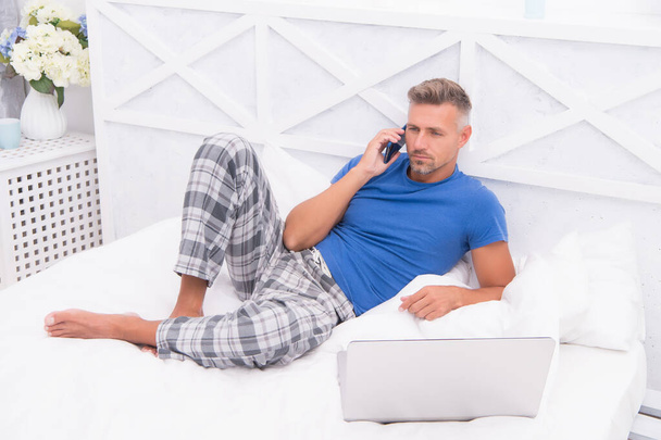 Remote work concept. Social networks. Online world. Man surfing internet work online. Digital marketing. Remote access. Mature man pajamas freelance worker relaxing at home. Online services - Zdjęcie, obraz