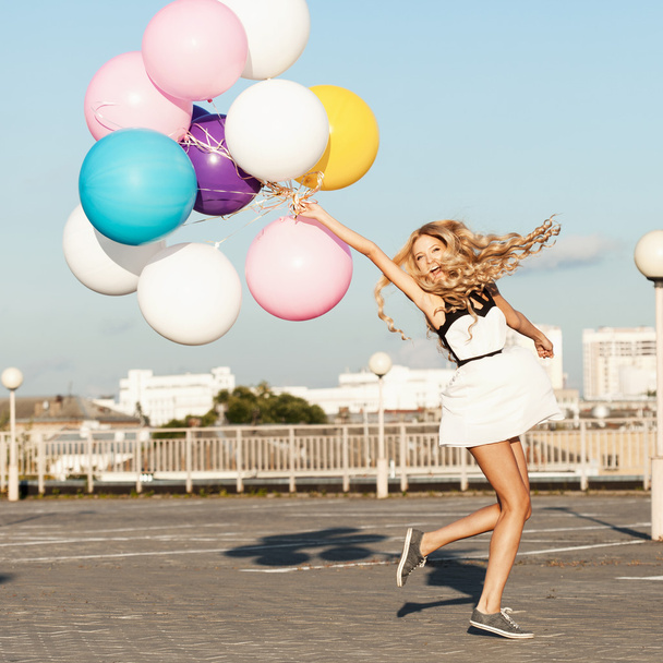 Happy young woman with colorful latex balloons - Zdjęcie, obraz