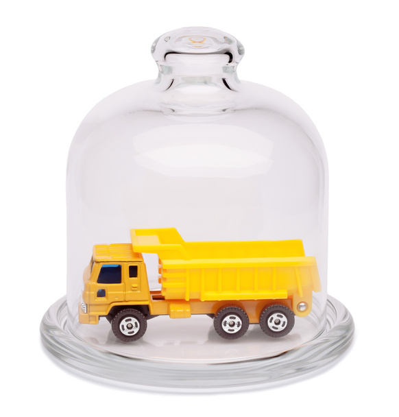 Toy dump truck in a glass dome. - Fotó, kép