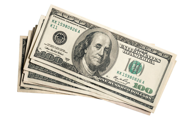 Veel Amerikaans geld, Amerikaanse dollars, liggen in een bundel boven elkaar. - Foto, afbeelding