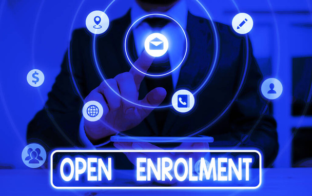 Conceptual hand writing showing Open Enrolment. Business photo showcasing period during which members can choose an alternate plan. - Photo, Image