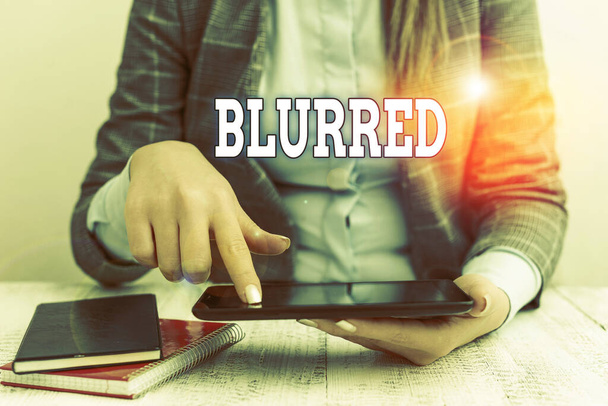Writing note showing Blurred. Business photo showcasing cannot or unable to see clearly because it has no distinct outline Business concept with communication mobile phone. - Photo, Image