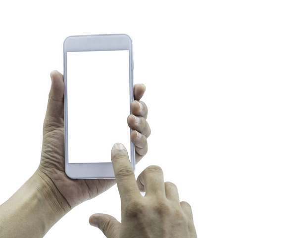Primer plano de la mano del hombre sosteniendo teléfono inteligente móvil blanco y el uso de señalar con el dedo para el tacto en la pantalla. pantalla blanca en blanco para maqueta aislada sobre fondo blanco con ruta de recorte
. - Foto, imagen