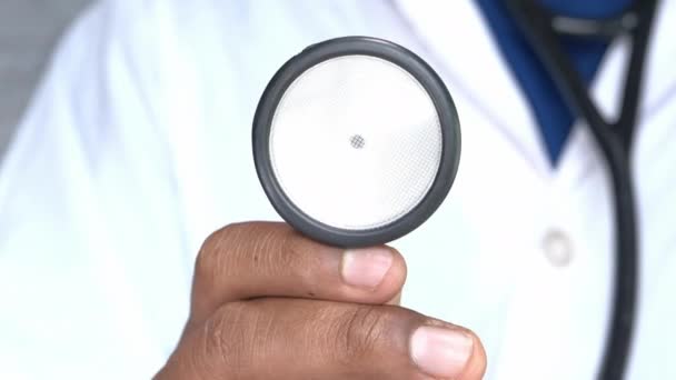 Doctor using stethoscope in hospital, close up - Footage, Video