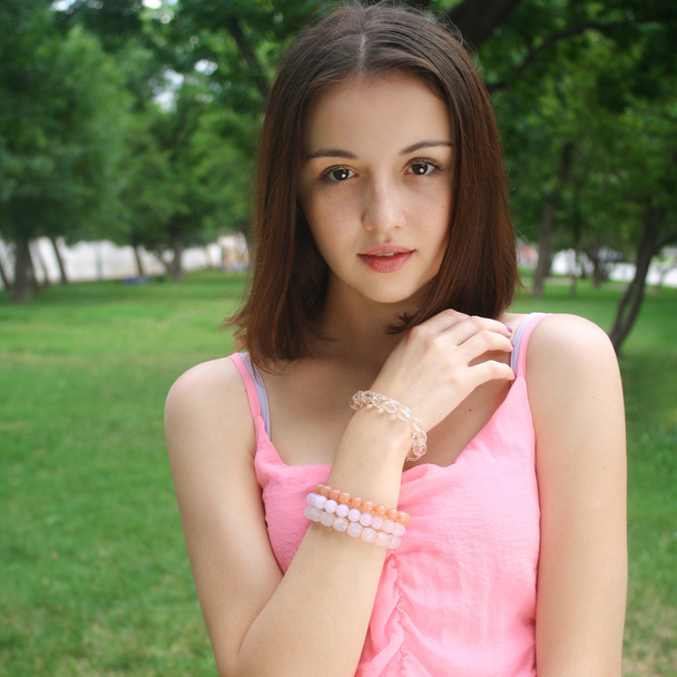 Beautiful face brunette girl in pink dress summer - Fotoğraf, Görsel