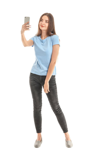 Красива молода жінка з мобільним телефоном на білому тлі
 - Фото, зображення