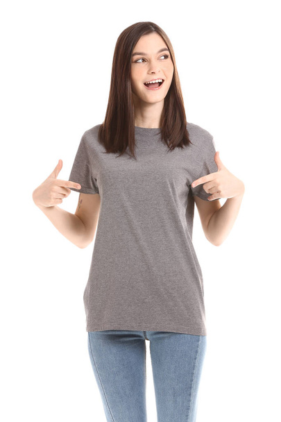 Woman in stylish t-shirt on white background - 写真・画像
