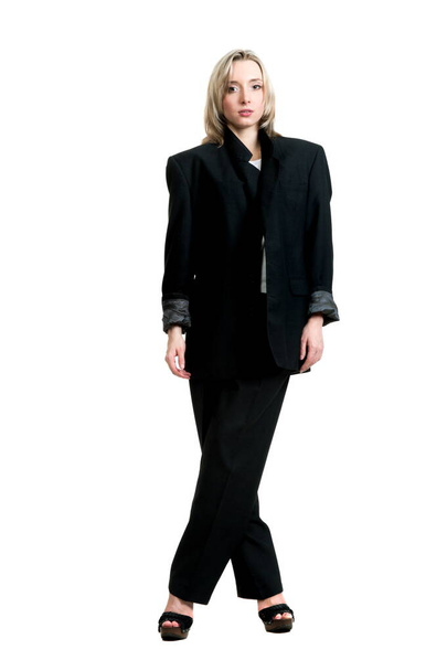 Krásná sexy blondýna dívka v černých kalhotách, bunda a košile na bílém pozadí izolace - Fotografie, Obrázek