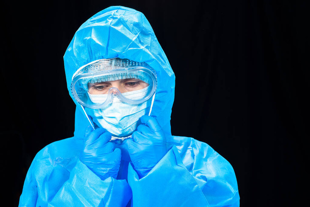 Virus. Woman in a protective antivirus suit. - Photo, Image