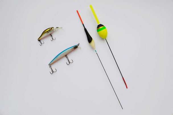 Fishing lures, isolated on white background. multi-colored lure. Small fishing float - Photo, Image