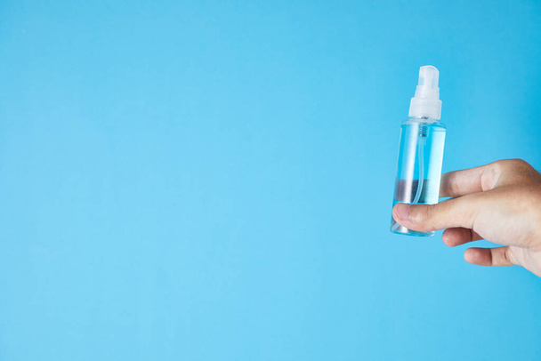 Closeup bottle of blue alcohol hand spray. corona virus concep - Foto, imagen