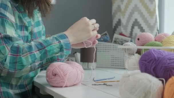 A young woman crochets. - Footage, Video