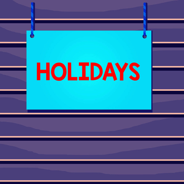 Conceptual hand writing showing Holidays. Business photo text an extended period of leisure and recreation spent away from home Wooden board wood empty frame fixed colorful striped string. - Photo, Image