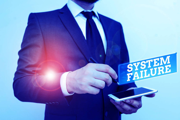 Text sign showing System Failure. Conceptual photo Occur because of a hardware failure or a software issue Male human wear formal work suit hold smart hi tech smartphone use one hand. - Photo, Image